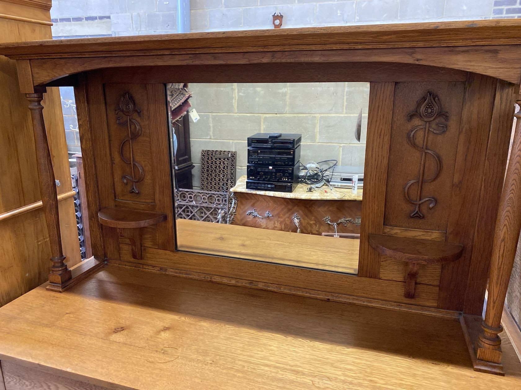 An early 20th century Art Nouveau oak mirrored back sideboard, length 137cm, width 52cm, height 172cm